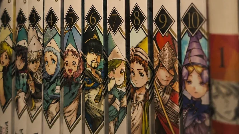 os dez volumes de witch hat atelier enfileirados na estante, com as lombadas numeradas de 1 a 10